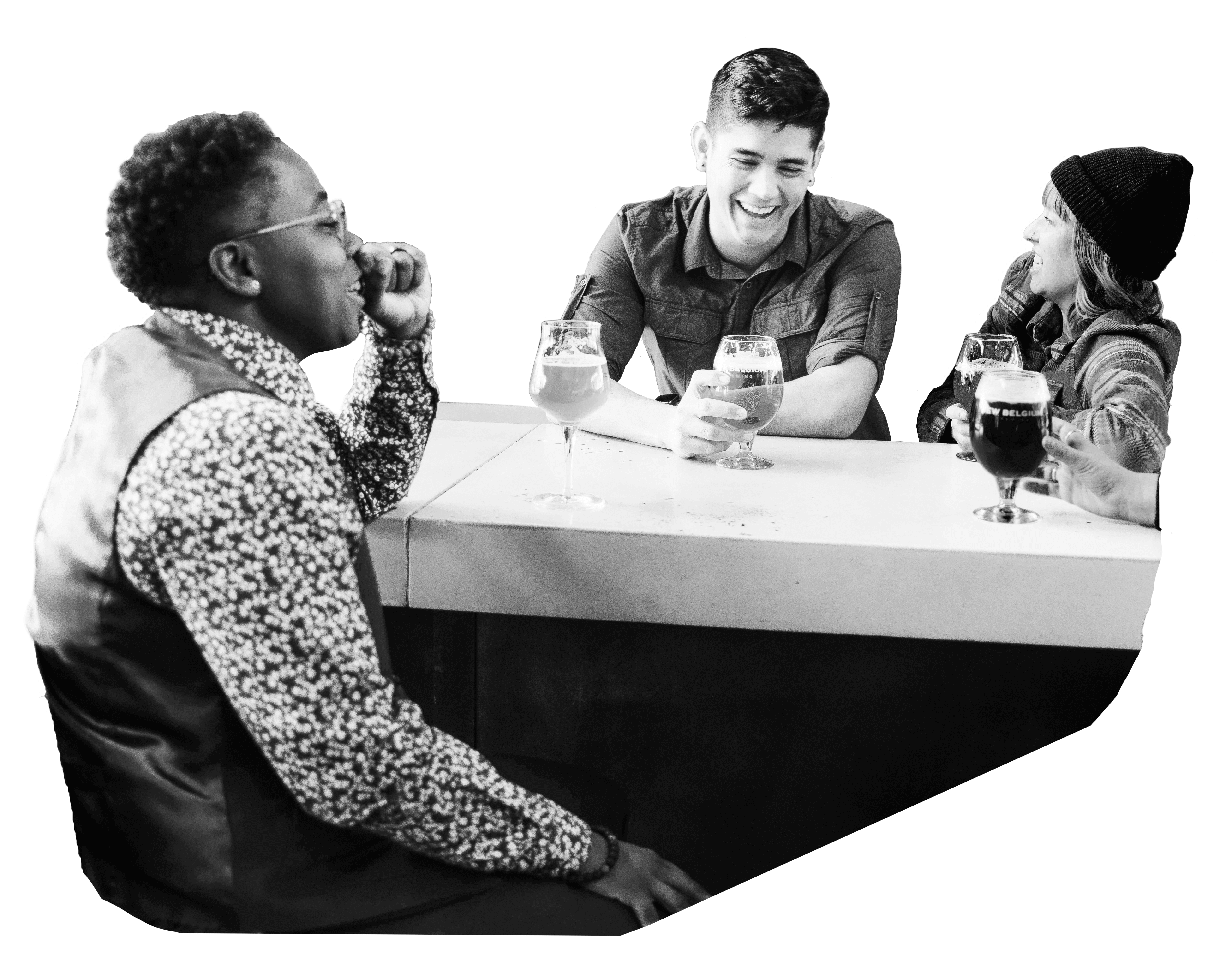 A group of coworkers sit visiting around a table, each with a beer in hand