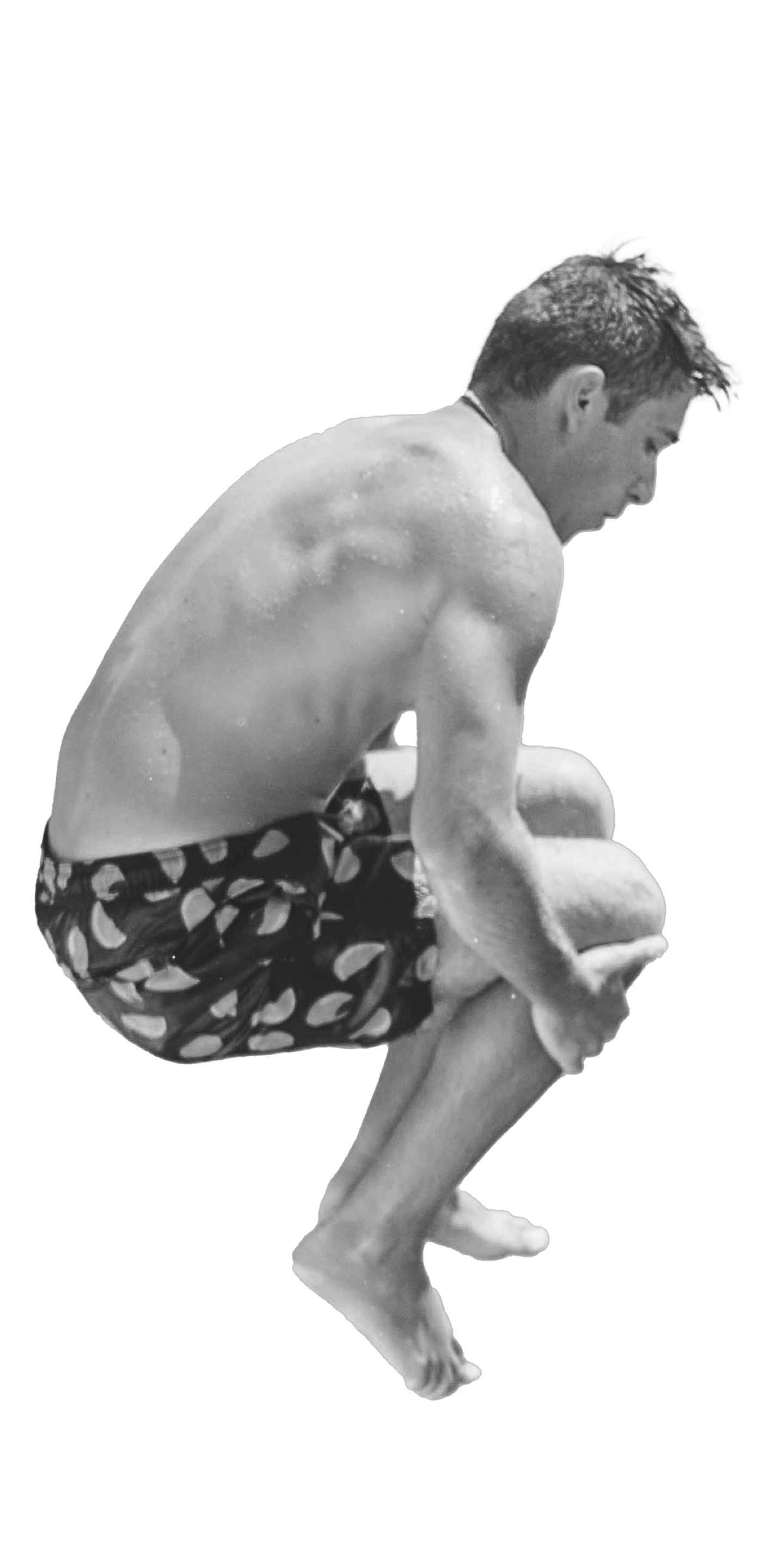 Man doing a cannonball into a pool.