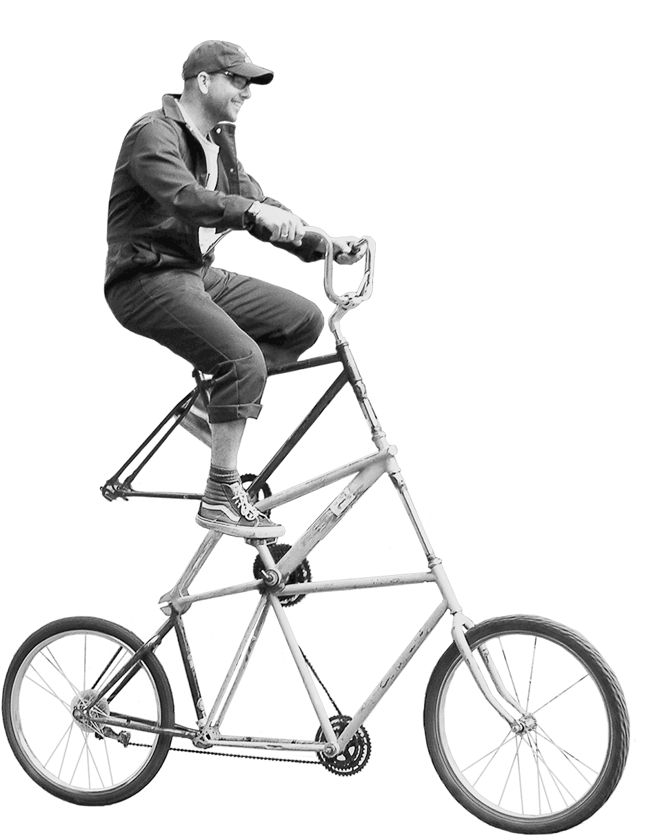 Man riding a tall bike